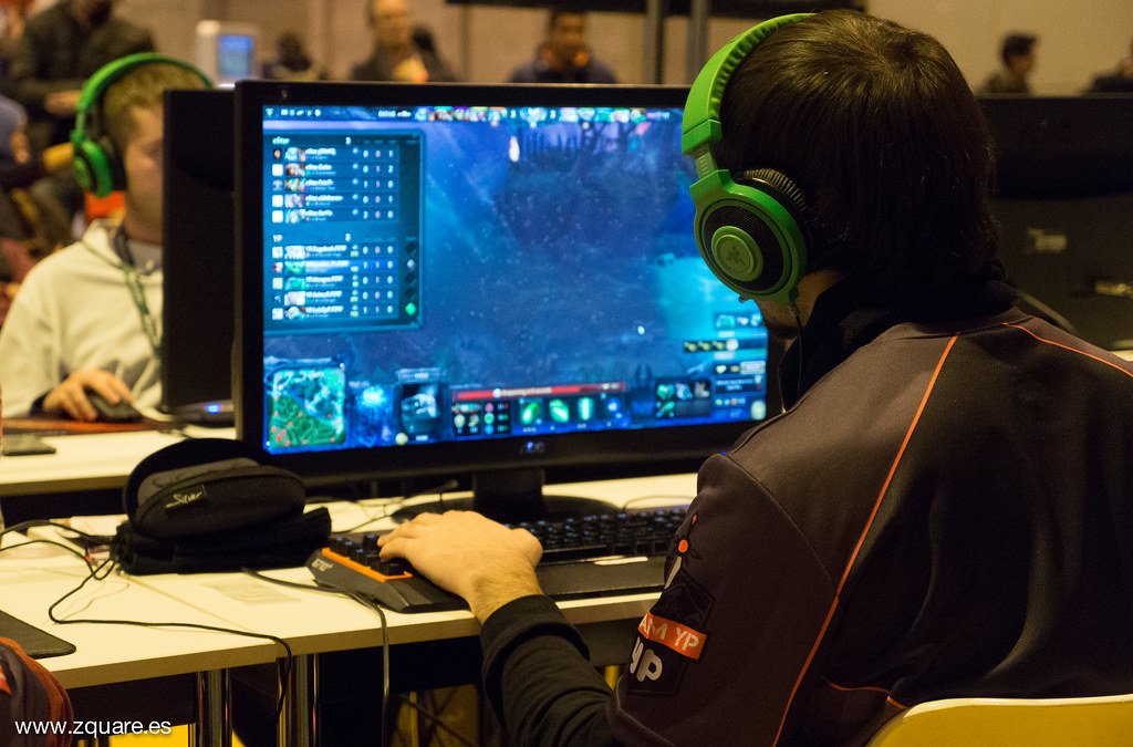 Esports players competing under a clan tag at a gaming event